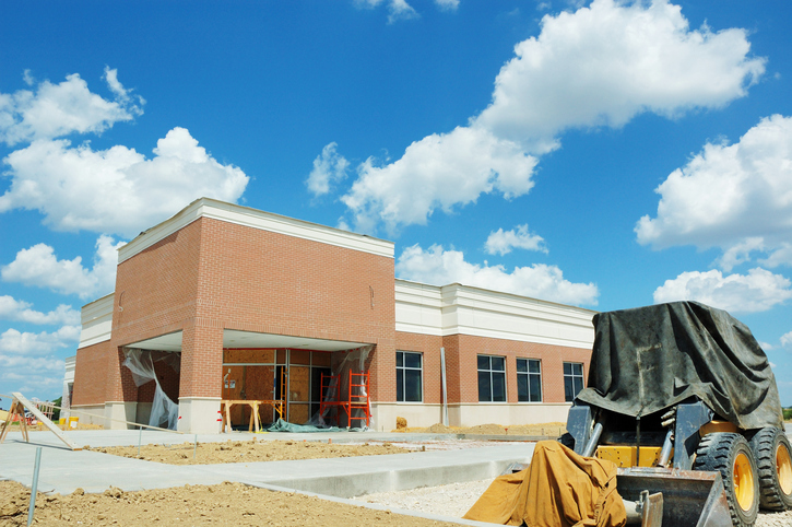 Construction site of an office building under blue skies